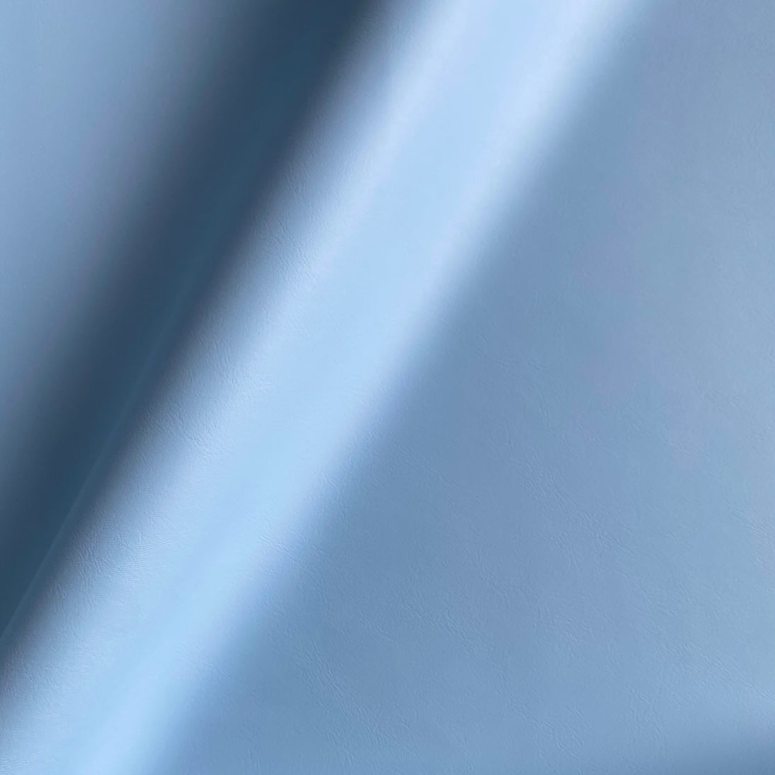 Eden Upholstery Vinyl: Azur Blue. Light Blue furniture vinyl